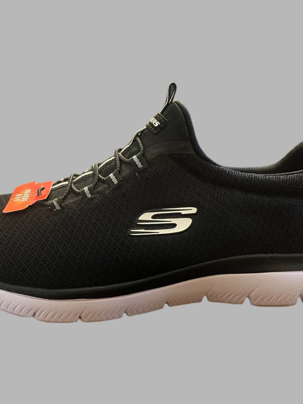 Skechers women’s black and white slip-on sneakers